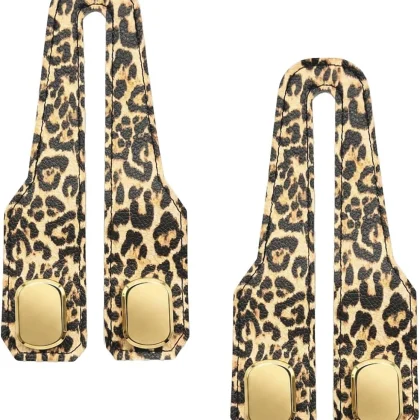 Two tan leopard print car seat headrest hooks on a white background